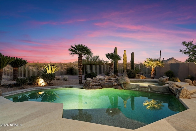 34599 N 99th Way, Scottsdale, AZ 85262 - pool at dusk with an in-ground hot tub and a fenced backyard