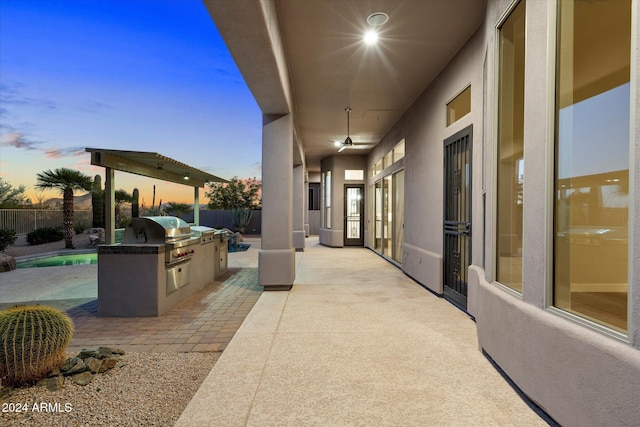 34599 N 99th Way, Scottsdale, AZ 85262 - patio terrace at dusk featuring a patio area and a ceiling fan