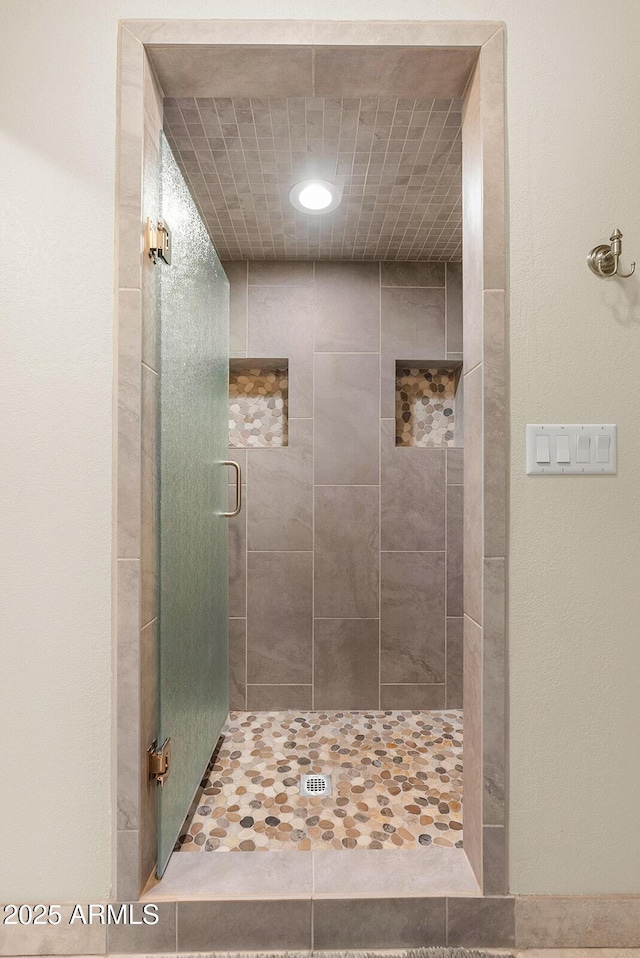 bathroom featuring a stall shower