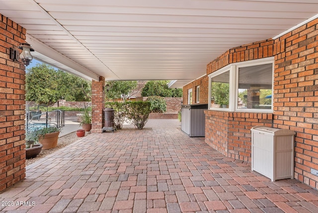 view of patio featuring fence