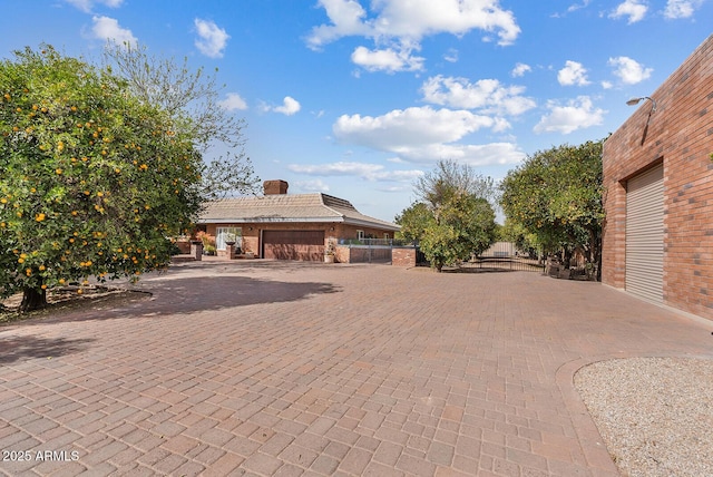 exterior space with fence and a chimney