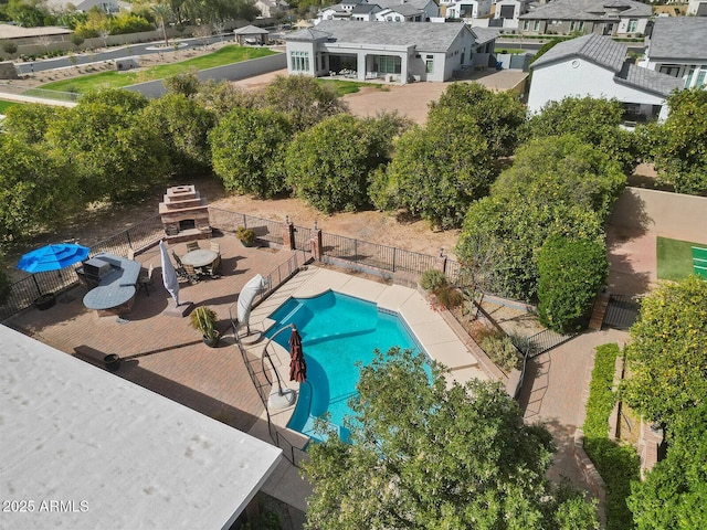 view of swimming pool featuring a residential view, fence, a fenced in pool, and a wooden deck