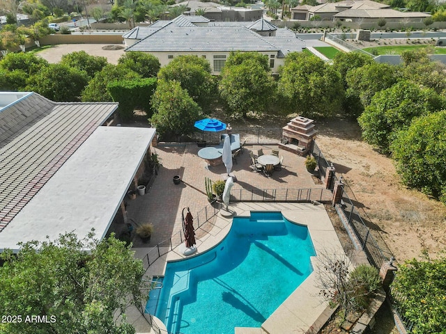 view of pool featuring a patio, fence, and a fenced in pool