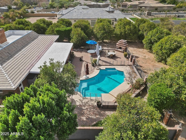 view of swimming pool with a patio area, a fenced backyard, and a fenced in pool