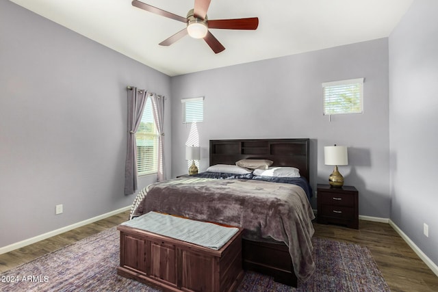 bedroom featuring ceiling fan and dark hardwood / wood-style flooring