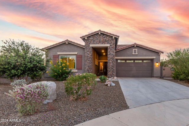 view of front of property with a garage