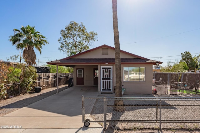 406 W 4th Ave, Buckeye, AZ 85326 - bungalow featuring a carport, driveway, and a fenced front yard