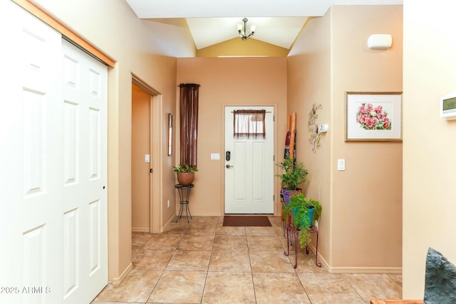 tiled entrance foyer with lofted ceiling