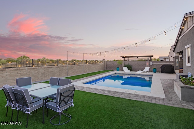 28883 N 131st Dr, Peoria, AZ 85383 - view of pool featuring a patio, a lawn, grilling area, and a fenced backyard