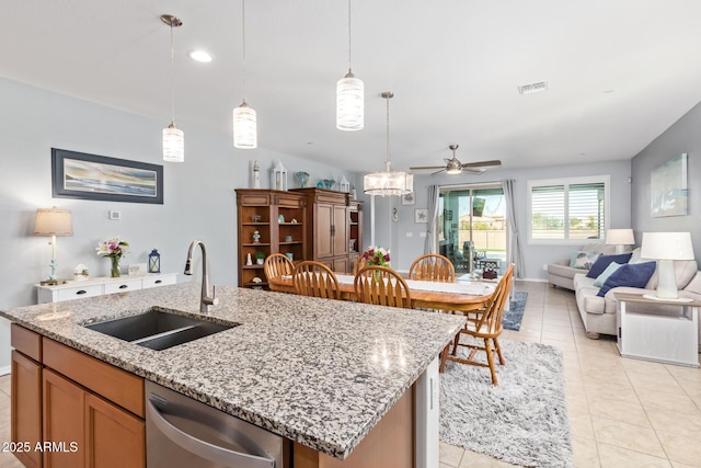 28883 N 131st Dr, Peoria, AZ 85383 - kitchen with decorative light fixtures, open floor plan, a sink, an island with sink, and dishwasher