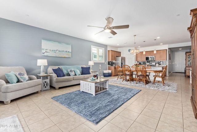 28883 N 131st Dr, Peoria, AZ 85383 - living room featuring light tile patterned floors, ceiling fan, and recessed lighting