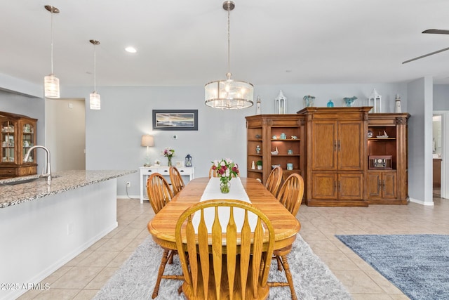 28883 N 131st Dr, Peoria, AZ 85383 - dining area featuring light tile patterned floors, recessed lighting, a notable chandelier, and baseboards