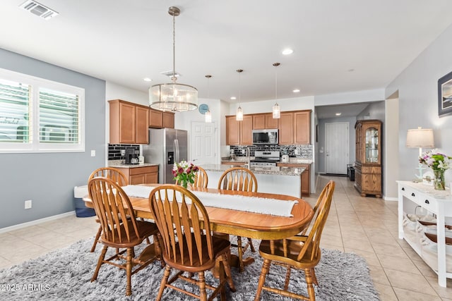28883 N 131st Dr, Peoria, AZ 85383 - dining space featuring light tile patterned floors, baseboards, visible vents, and recessed lighting