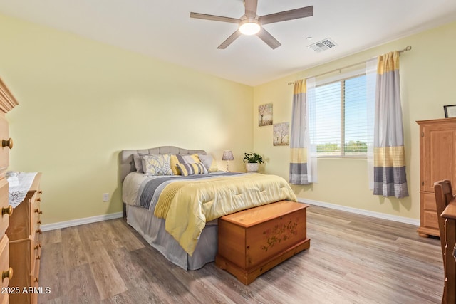 28883 N 131st Dr, Peoria, AZ 85383 - bedroom featuring wood finished floors, visible vents, and baseboards