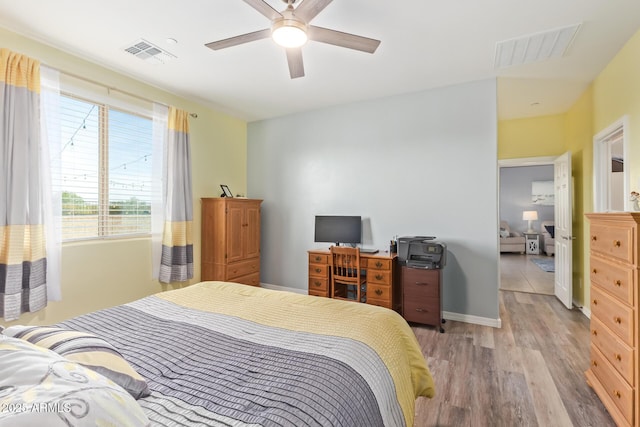 28883 N 131st Dr, Peoria, AZ 85383 - bedroom with light wood finished floors, baseboards, visible vents, and ceiling fan