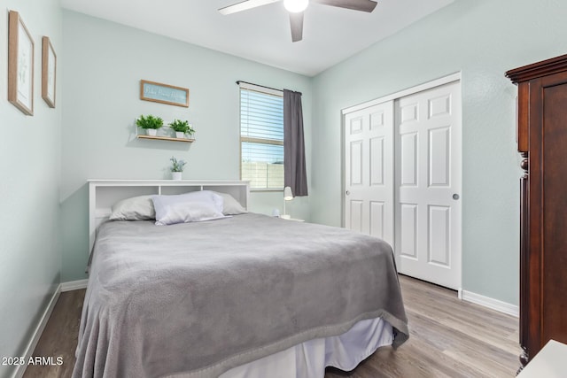 28883 N 131st Dr, Peoria, AZ 85383 - bedroom featuring a ceiling fan, a closet, light wood-style flooring, and baseboards