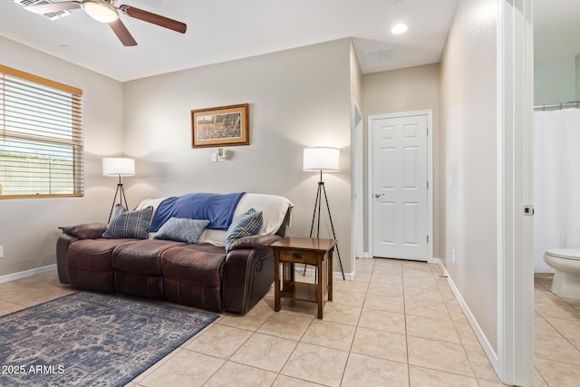 28883 N 131st Dr, Peoria, AZ 85383 - living room with light tile patterned floors, baseboards, and a ceiling fan
