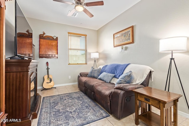 28883 N 131st Dr, Peoria, AZ 85383 - living area with visible vents, ceiling fan, baseboards, and light tile patterned floors