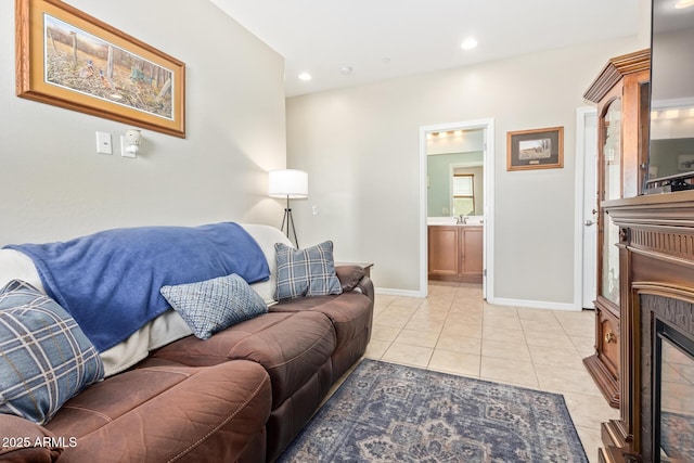 28883 N 131st Dr, Peoria, AZ 85383 - living area featuring recessed lighting, baseboards, light tile patterned flooring, and a glass covered fireplace