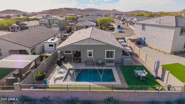 28883 N 131st Dr, Peoria, AZ 85383 - view of swimming pool with a residential view, a patio area, a fenced backyard, and a mountain view