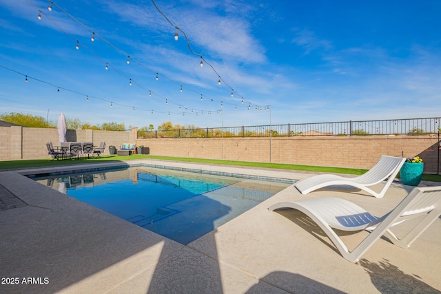 28883 N 131st Dr, Peoria, AZ 85383 - view of swimming pool featuring a fenced in pool, a patio area, and a fenced backyard