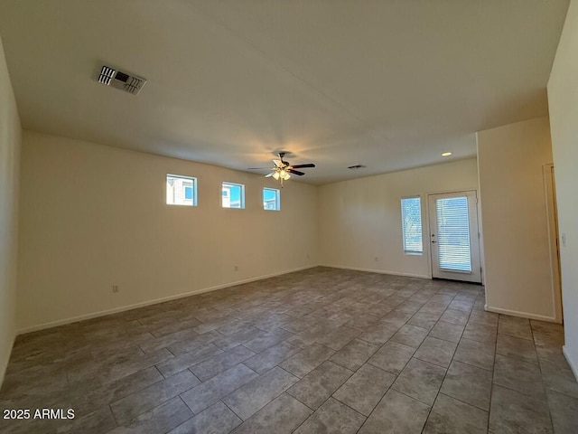 empty room featuring ceiling fan