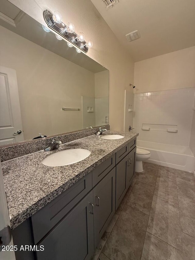 full bathroom featuring vanity, toilet, tub / shower combination, and tile patterned flooring