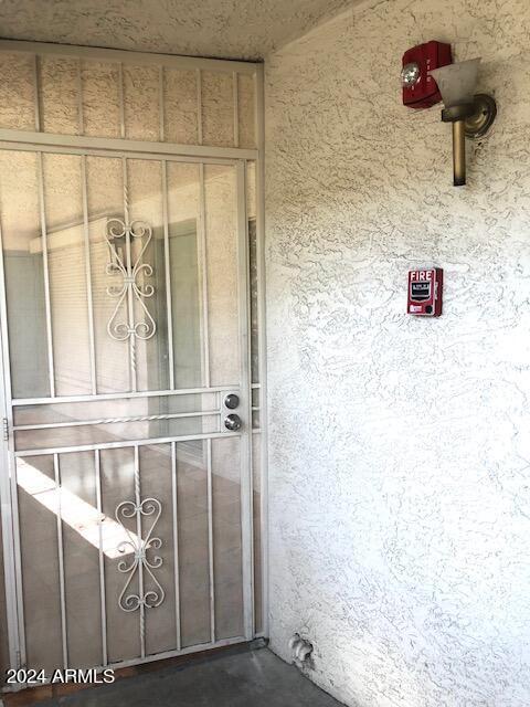 property entrance featuring stucco siding