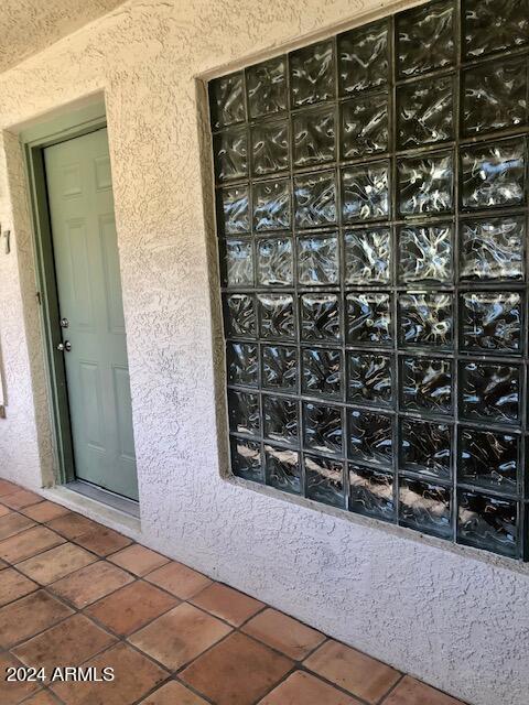 property entrance featuring stucco siding