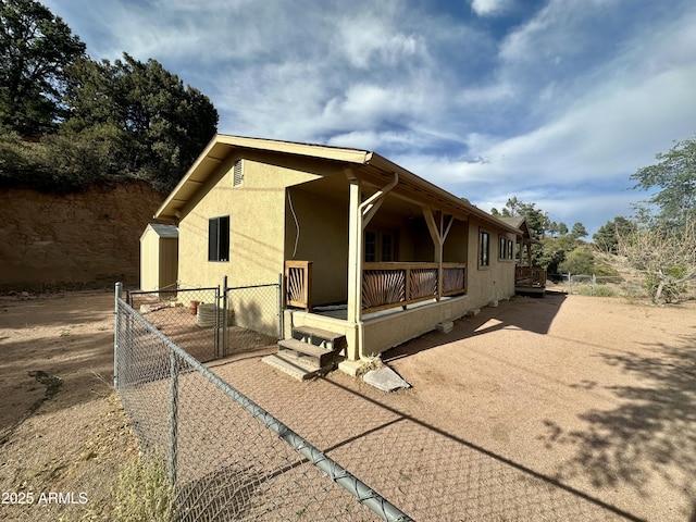 414 W Frontier St Unit A, Payson, AZ 85541 - view of home's exterior with stucco siding and a gate