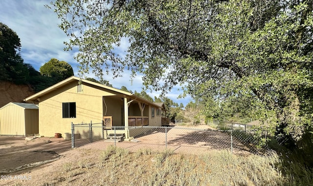 414 W Frontier St Unit A, Payson, AZ 85541 - view of property exterior featuring stucco siding, a gate, and a patio