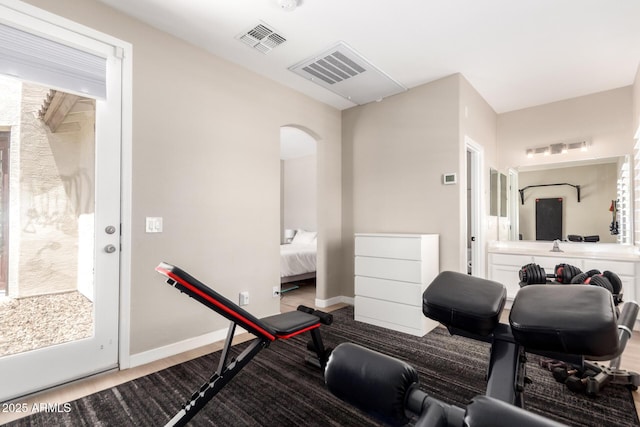 6870 S Crestview Dr, Gilbert, AZ 85298 - workout area with arched walkways and baseboards