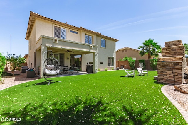 6870 S Crestview Dr, Gilbert, AZ 85298 - back of property featuring ceiling fan, a patio area, and stucco siding