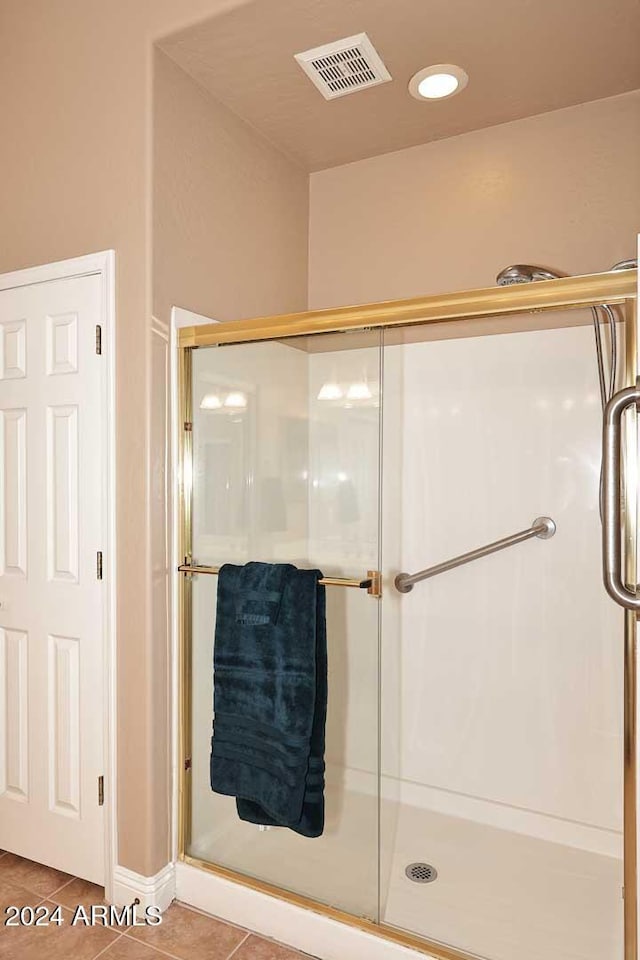 bathroom featuring tile patterned flooring and walk in shower