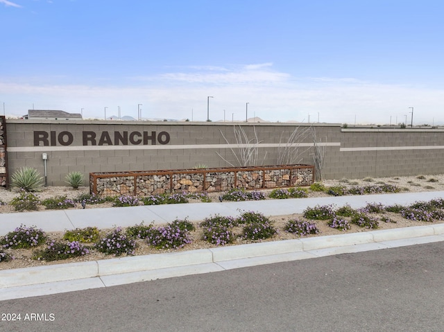 community sign with fence