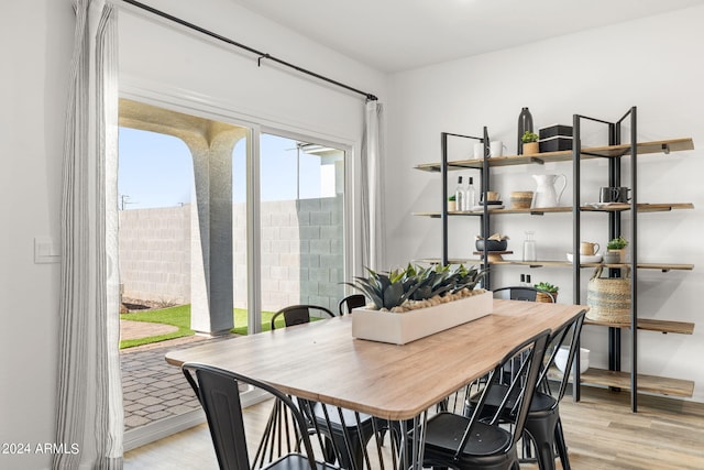 dining area with light wood finished floors