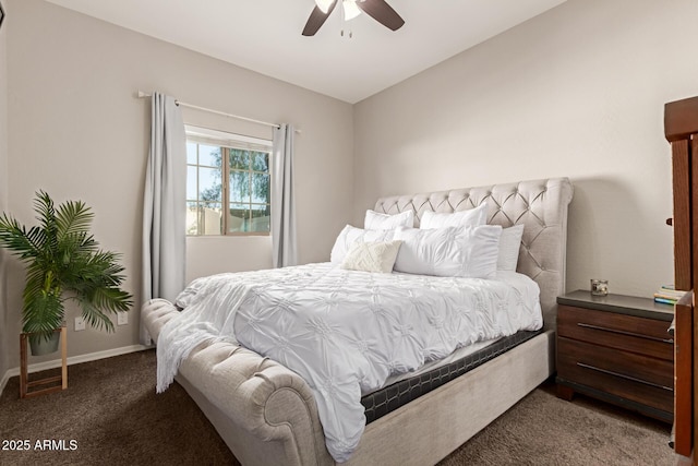 bedroom with baseboards, a ceiling fan, and dark colored carpet