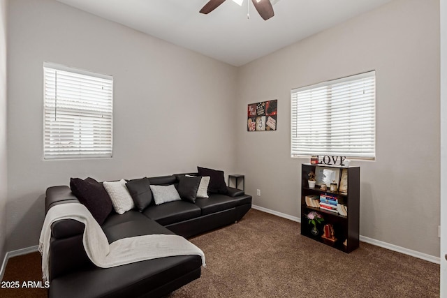 carpeted living room featuring a wealth of natural light, baseboards, and ceiling fan