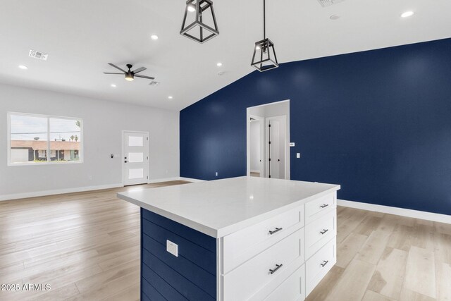2122 W Virginia Ave, Phoenix, AZ 85009 - kitchen featuring a ceiling fan, light wood-style floors, lofted ceiling, open floor plan, and white cabinets