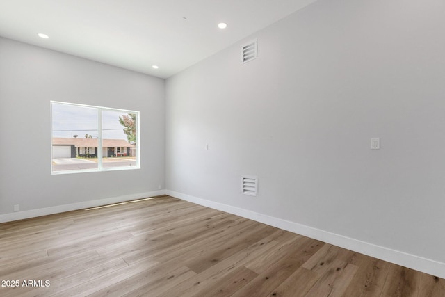 2122 W Virginia Ave, Phoenix, AZ 85009 - empty room with recessed lighting, light wood-style floors, and baseboards