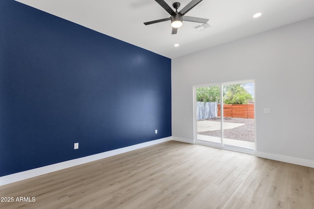 2122 W Virginia Ave, Phoenix, AZ 85009 - empty room with wood finished floors, baseboards, ceiling fan, and recessed lighting