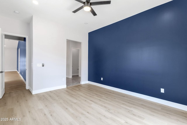 2122 W Virginia Ave, Phoenix, AZ 85009 - unfurnished room with a ceiling fan, light wood-type flooring, baseboards, and a smoke detector