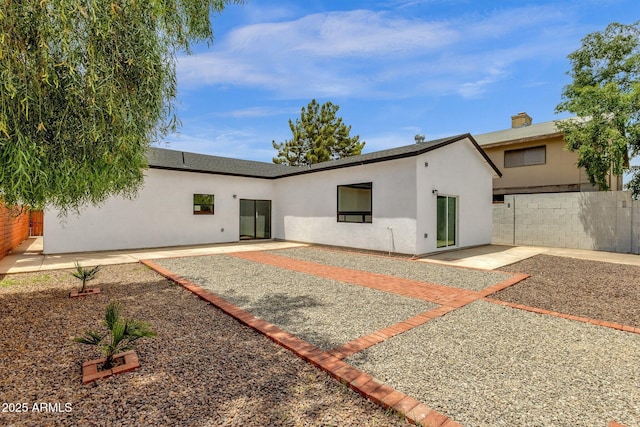 2122 W Virginia Ave, Phoenix, AZ 85009 - back of property with stucco siding and a patio area