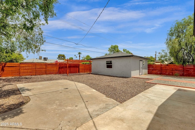 2122 W Virginia Ave, Phoenix, AZ 85009 - rear view of house featuring a patio, a fenced backyard, and stucco siding