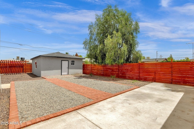 2122 W Virginia Ave, Phoenix, AZ 85009 - fenced backyard featuring a patio and an outdoor structure