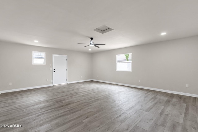 2122 W Virginia Ave, Phoenix, AZ 85009 - spare room featuring recessed lighting, wood finished floors, baseboards, and attic access