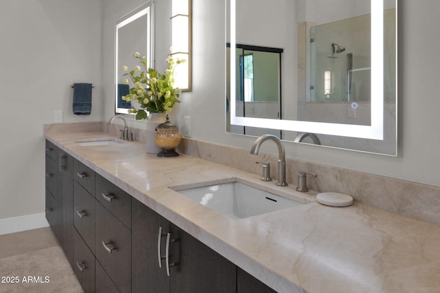 bathroom featuring vanity, an enclosed shower, and tile patterned flooring