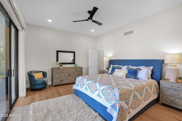 bedroom with ceiling fan and hardwood / wood-style floors