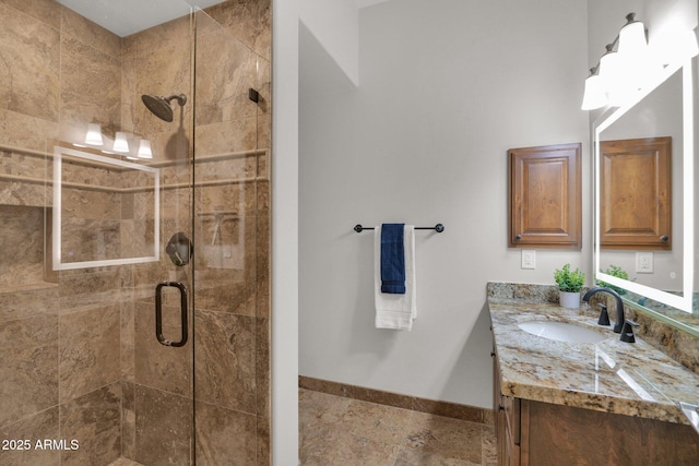 bathroom featuring vanity and a shower with shower door