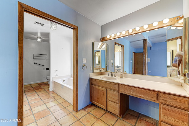 full bath with vanity, toilet, visible vents, and a washtub